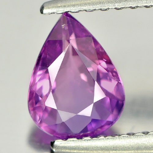 Certified Natural Unheated Violetish Pink Sapphire 0.99 Ct. VS Pear Shape 7.35 x 5.60 Mm. Gemstone: Product ID: 806131112 Product Name: Natural Purple Sapphire Weight: 0.99 CT. Size: 7.35 x 5.60 x 2.97 MM. Shape: Pear Color: Violetish Pink Clarity:VS Luster: Very Good Gems Origin: Madagascar Treatme