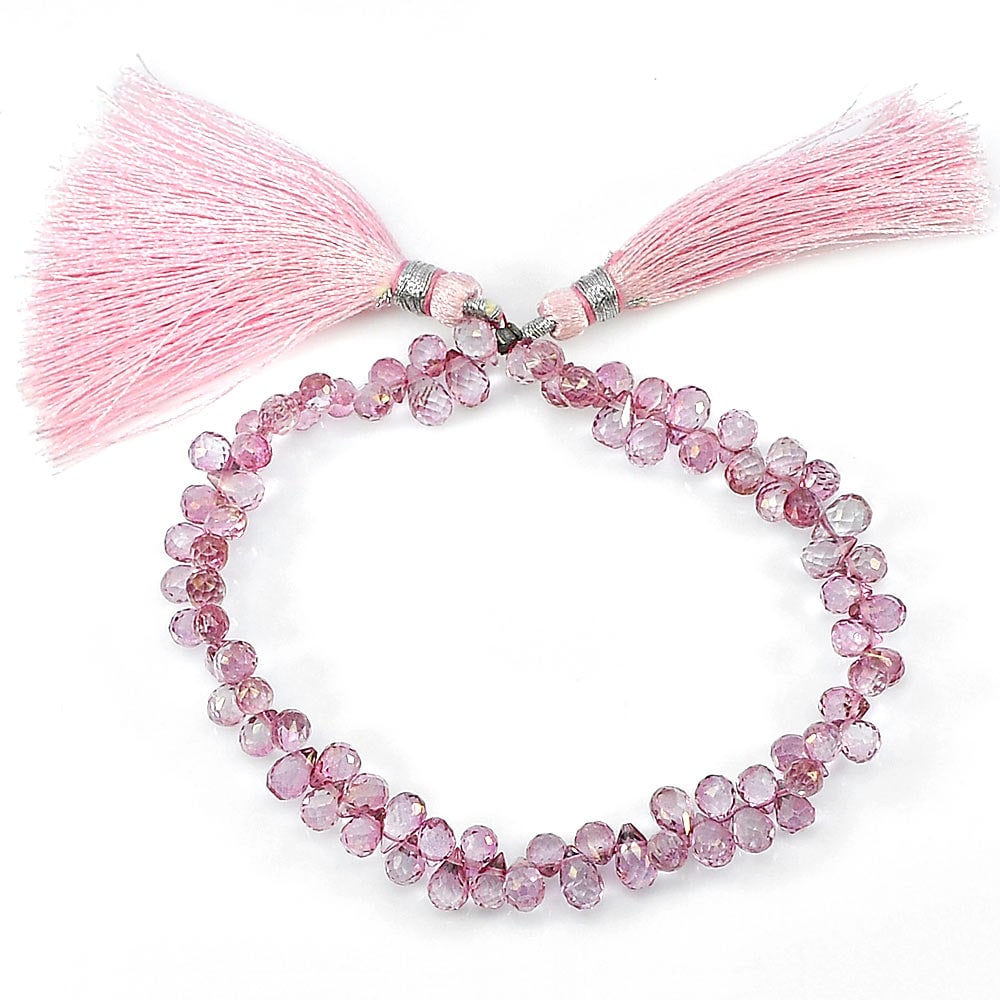 Natural Pink Topaz Beads Length 8 Inch 80.50 Ct. Briolette Shape 5.7 x 4.4 Mm.: Product ID: 807136412 Product Name: Natural Topaz Weight: 80.50 CT. Size: 8 Inch / 5.7 x 4.4 x 4.4 MM. Shape: Briolette With Drilled Color: Pink Clarity:IF - VVS Luster: Good Gems Origin: Brazil Treat