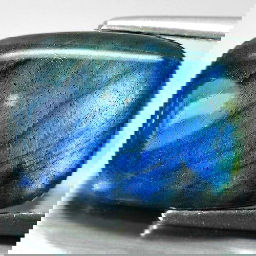 Natural Multi Color Blue Labradorite Doublet 8.99 Ct. Baguette Cabochon Shape 16 x 12 x 5 Mm.: Product ID: 804301233 / Product Name: Natural Labradorite / Weight: 8.99 CT. / Size: 16 x 12 x 5 MM. / Shape: Baguette Cabochon / Color: Multi-Color / Clarity:Opaque / Luster: Iridescent / Gems Origin