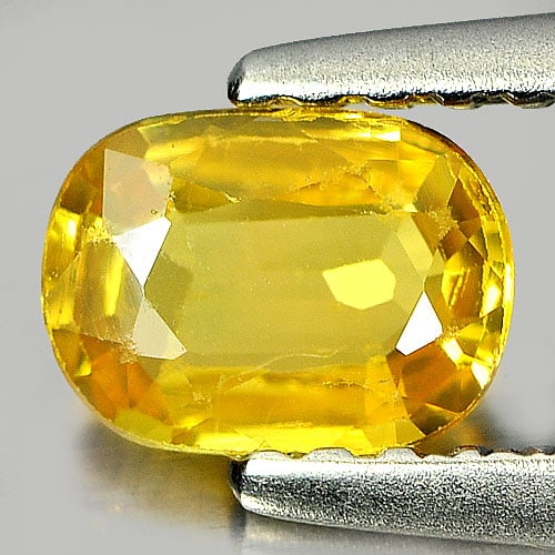 Natural Yellow Sapphire 0.55 Ct. Oval Shape 6 x 4.3 x 2 Mm. Gemstone From Thailand: Product ID: 806160943 / Product Name: Natural Yellow Sapphire / Weight: 0.55 CT. / Size: 6 x 4.3 x 2 MM. / Shape: Oval / Color: Yellow / Clarity:VSI / Luster: Good / Gems Origin: Thailand / Treatment: