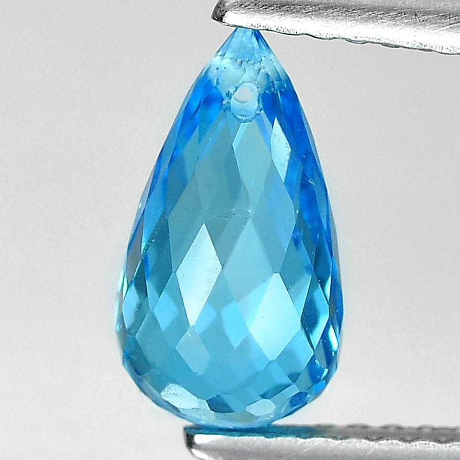 Natural Swiss Blue Topaz 2.48 Ct. Briolette with Drilled 10 x 5.7 Mm. Gemstone: Product ID: 807164556 / Product Name: Natural Blue Topaz / Weight: 2.48 CT. / Size: 10 x 5.7 x 5.7 MM. / Shape: Briolette with Drilled / Color: Swiss Blue / Clarity:VSI / Luster: Good / Gems Origin: B