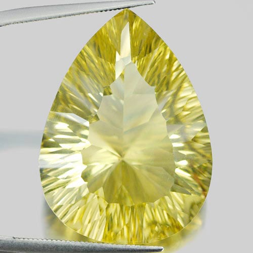 Quartz Yellow Lemon 37.27 Ct. Clean Pear Concave Cut 27 x 22 Mm. Natural Gem: Product ID: 805526153 / Product Name: Natural Quartz / Weight: 37.27 CT. / Size: 27 x 22 x 11.6 MM. / Shape: Pear Concave Cut / Color: Yellow / Clarity:IF / Luster: Very Good / Gems Origin: Brazil / T