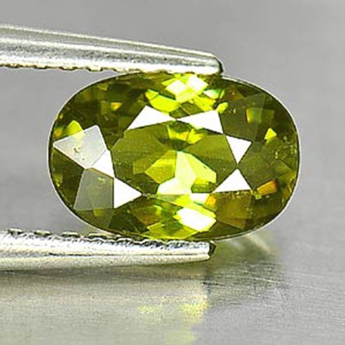 Demantoid Garnet 1.26 Ct. Oval Shape 7.8 x 5.3 Mm. Natural Unheated Gemstone From Madagascar: Product ID: 802930704 / Product Name: Natural Demantoid / Weight: 1.26 CT. / Size: 7.8 x 5.3 x 3.5 MM. / Shape: Oval / Color: Yellowish Green / Clarity:SI / Luster: Good / Gems Origin: Madagascar / Tr