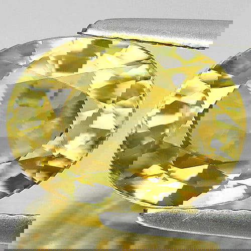 Yellow Zircon 7.86 Ct. Clean Oval Shape 12 x 8.8 Mm. Natural Gemstone From Cambodia: Product ID: 807715027 / Product Name: Natural Zircon / Weight: 7.86 CT. / Size: 12 x 8.8 x 6.5 MM. / Shape: Oval / Color: Yellow / Clarity:IF / Luster: Good / Gems Origin: Cambodia / Treatment: Heated