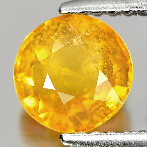 Yellow Sapphire 1.56 Ct. Round Shape 6.5 Mm. Natural Gemstone From Thailand: Product ID: 806139991 / Product Name: Natural Yellow Sapphire / Weight: 1.56 CT. / Size: 6.5 x 6.5 x 3.9 MM. / Shape: Round / Color: Yellow / Clarity:SI2 / Luster: Good / Gems Origin: Thailand / Treat