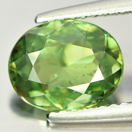 Certified Natural Demantoid Garnet 1.98 Ct. Oval Shape 8.76 x 7 Mm. Unheated Gemstone: Product ID: 802914337 Product Name: Natural Demantoid Weight: 1.98 CT. Size: 8.76 x 7.00 x 3.70 MM. Shape: Oval Color: Green Clarity:VSI Luster: Very Good Gems Origin: Madagascar Treatment: Unheated C