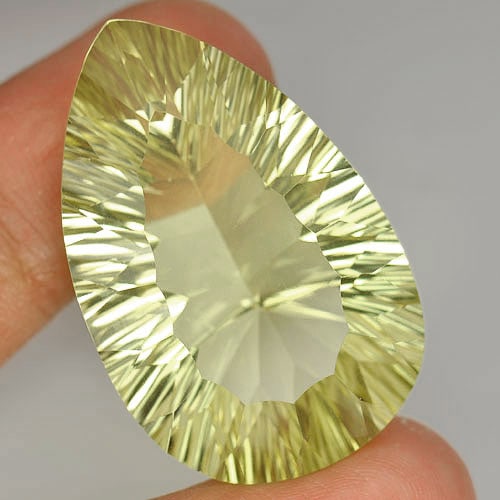 Natural Yellow Lemon Quartz 51.45 Ct. Clean Pear Concave Cut Shape 34 x 22 Mm. Gemstone Unheated: Product ID: 805526353 Product Name: Natural Quartz Weight: 51.45 CT. Size: 34 x 22 x 13.3 MM. Shape: Pear Concave Cut Color: Yellow Clarity:IF Luster: Very Good Gems Origin: Brazil Treatment: Unheated