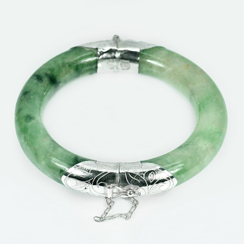Natural Gemstone Green Jade 439.32 Ct. Bangle with Silver Jewelry Diameter 60 Mm.: Product ID: 819809058 Product Name: Natural Jade Weight: 439.32 CT. Size: 85 / 60 / 13 MM. Shape: Round Color: Green Clarity:Opaque Luster: Good Gems Origin: Thailand Treatment: Unheated Crystal Struc