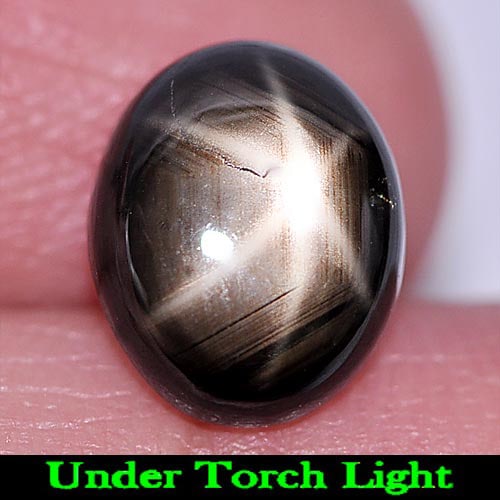 Black Star 6 Rays Sapphire 4.28 Ct. Oval Cabochon Shape 9.7 x 7.8 Mm. Natural Gemstone From Thailand: Product ID: 806155149 Product Name: Natural Star Sapphire Weight: 4.28 CT. Size: 9.7 x 7.8 x 5 MM. Shape: Oval Cabochon Color: Black Clarity:Opaque Luster: Good 6 Rays Star Gems Origin: Thailand Treat