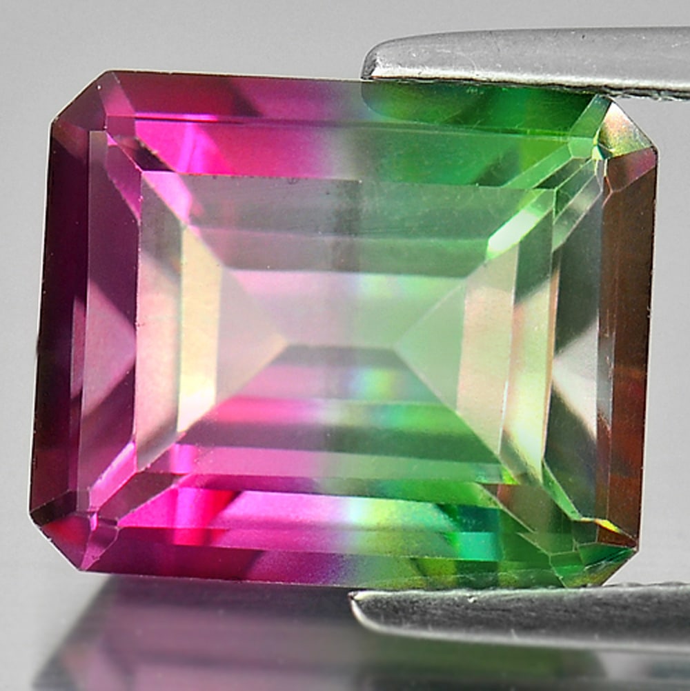 Emerald Envy Pure Pink Topaz 7.81 Ct. VVS Octagon Shape 12.2 x 10 Mm. Natural Gemstone From Brazil: Product ID: 807166459 Product Name: Natural Topaz Weight: 7.81 CT. Size: 12.2 x 10 x 7 MM. Shape: Octagon Color: Bi-Color Clarity:VVS Luster: Good Gems Origin: Brazil Treatment: Treated Crystal Struct