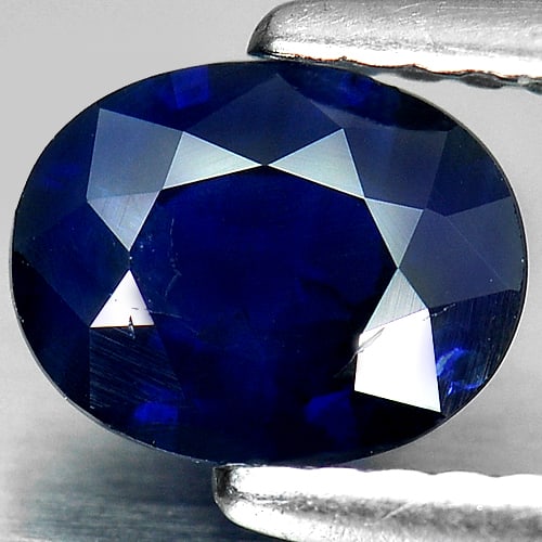 Blue Sapphire 0.91 Ct. Oval Shape 6.8 x 5.4 Mm. Natural Gemstone From Thailand: Product ID: 806006232 Product Name: Natural Blue Sapphire Weight: 0.91 CT. Size: 6.8 x 5.4 x 2.9 MM. Shape: Oval Color: Blue Clarity:SI Luster: Good Gems Origin: Thailand Treatment: Heated Crystal Str