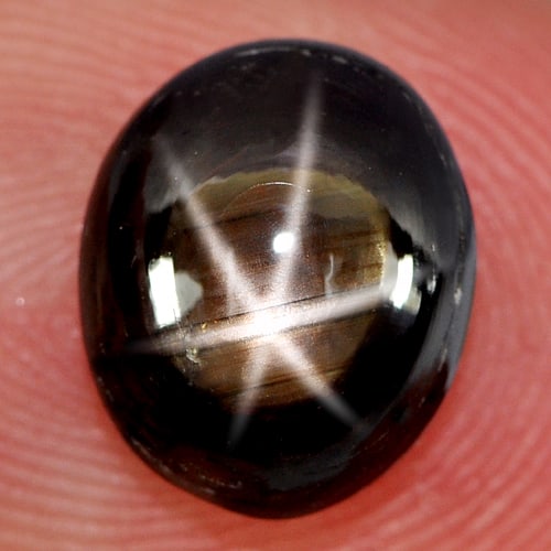 Natural Black Star Sapphire 6 Rays 4.22 Ct. Oval Cabochon Shape 9.9 x 8.2 Mm. Gemstone From Thailand: Product ID: 806137541 Product Name: Natural Star Sapphire Weight: 4.22 CT. Size: 9.9 x 8.2 x 4.6 MM. Shape: Oval Cabochon Color: Black Clarity:Opaque Luster: Good 6 Rays Star Gems Origin: Thailand Tre