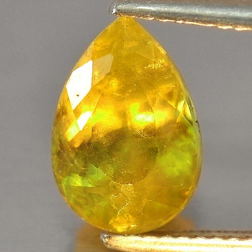 Intense Green Titanium Red Spark Sphene 3.23 Ct. Pear Shape 11 x 7.5 Mm. Natural Gemstone From: Product ID: 806504603 Product Name: Natural Sphene Weight: 3.23 CT. Size: 11 x 7.5 x 5.8 MM. Shape: Pear Color: Intense Green With Red Spark Clarity:VSI - SI Luster: Adamantine Gems Origin: Madagascar