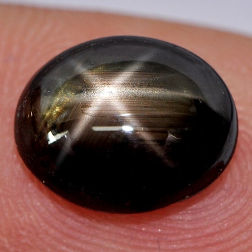 Black Star Sapphire 4.61 Ct. Oval Cabochon Shape 10.5 x 8.5 Mm. Natural Gemstone From Thailand: Product ID: 806134869 Product Name: Natural Star Sapphire Weight: 4.61 CT. Size: 10.5 x 8.5 x 4.6 MM. Shape: Oval Cabochon Color: Black Clarity:Opaque Luster: Good 6 Rays Star Gems Origin: Thailand Tr