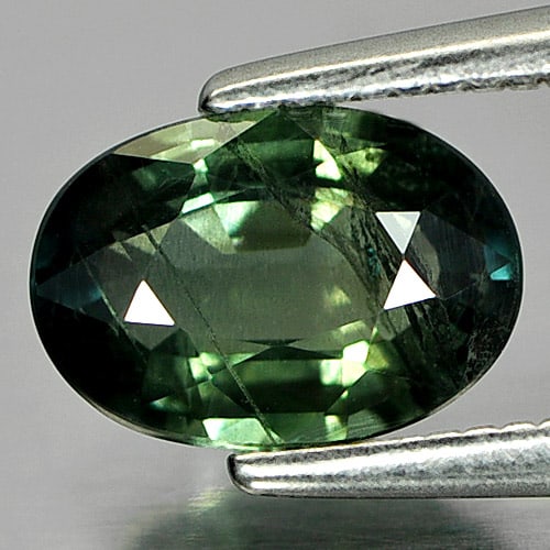 Natural Green Sapphire 1.37 Ct. Oval Shape 7.9 x 5.5 Mm. Gemstone From Thailand: Product ID: 806144384 Product Name: Natural Green Sapphire Weight: 1.37 CT. Size: 7.9 x 5.5 x 3.3 MM. Shape: Oval Color: Blueish Green Clarity:SI Luster: Good Gems Origin: Thailand Treatment: Heated C