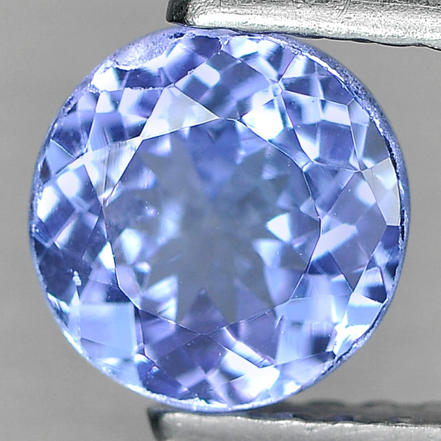 Natural Violetish Blue Tanzanite 0.87 Ct. Round Shape 6 Mm. Gemstone From Tanzania: Product ID: 807011270 Product Name: Natural Tanzanite Weight: 0.87 CT. Size: 6 x 3.4 MM. Shape: Round Color: Blue Clarity:SI2 Luster: Good Gems Origin: Tanzania Treatment: Heated Crystal Structure: Or