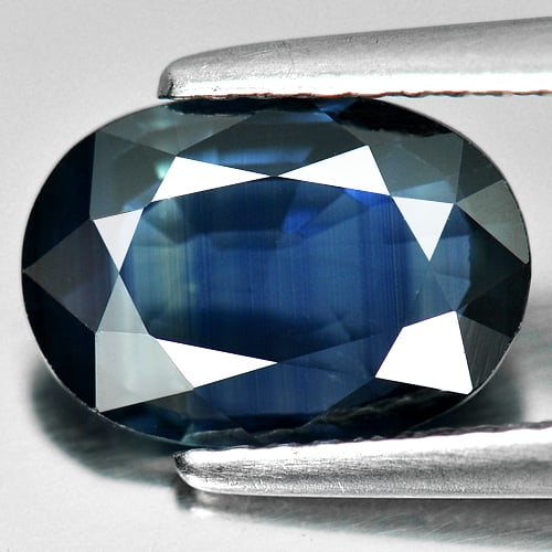 Certified Blue Sapphire 2.29 Ct. Oval Shape 10.11 x 7.08 Mm. Natural Gemstone From Thailand: Product ID: 806008806 Product Name: Natural Blue Sapphire Weight: 2.29 CT. Size: 10.11 x 7.08 x 3.19 MM. Shape: Oval Color: Blue Clarity:VSI Luster: Good Gems Origin: Thailand Treatment: Heated Crysta