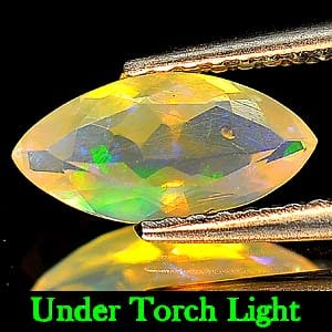Natural Multi-Color Play Of Colour Opal 0.52 Ct. Marquise Shape 9.7 x 4.8 Mm. Gemstone From Ethiopia: Product ID: 818719435 Product Name: Natural Opal Weight: 0.52 CT. Size: 9.7 x 4.8 x 3.2 MM. Shape: Marquise Color: Multi Color Clarity:Semi - Transparent Luster: Good Gems Origin: Ethiopia Treatment: 