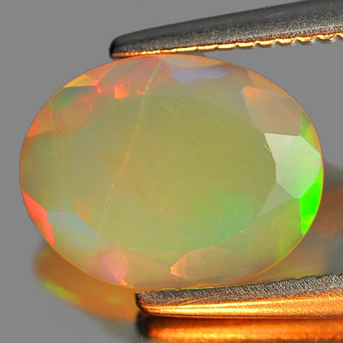 Natural Gem Multi Color Play Of Colour Opal 0.66 Ct. Oval Shape 9 x 7 Mm. Gemstone From Ethiopia (1 of 3)