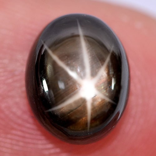 Natural Black Star Sapphire 6 Rays 4.81 Ct. Oval Cabochon Shape 10.2 x 8.1 Mm. Gemstone: Product ID: 806132812 Product Name: Natural Star Sapphire Weight: 4.81 CT. Size: 10.2 x 8.1 x 4.8 MM. Shape: Oval Cabochon Color: Black Clarity:Opaque Luster: Good 6 Rays Star Gems Origin: Thailand Tr