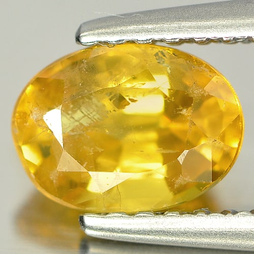 Natural Yellow Sapphire 1.24 Ct. Oval Shape 7 x 5.2 Mm. Gemstone From Thailand: Product ID: 806125077 Product Name: Natural Yellow Sapphire Weight: 1.24 CT. Size: 7 x 5.2 x 3.9 MM. Shape: Oval Color: Yellow Clarity:SI Luster: Good Gems Origin: Bangkaja, Thailand Treatment: Heated
