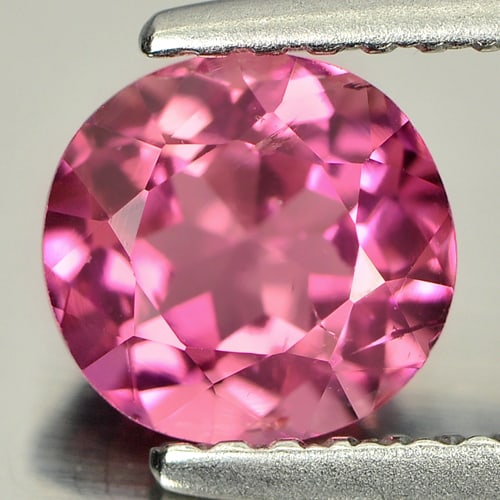 Natural Pink Tourmaline 1.04 Ct. Oval Shape 6.4 x 6 Mm. Unheated Gemstone From Nigeria: Product ID: 807236413 Product Name: Natural Tourmaline Weight: 1.04 CT. Size: 6.4 x 6 x 4 MM. Shape: Oval Color: Purplish Pink Clarity:SI1 Luster: Good Gems Origin: Nigeria Treatment: Unheated Crystal