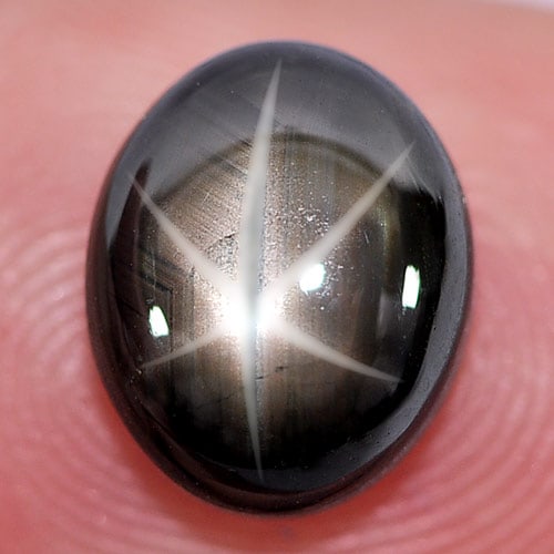 Natural Black Star Sapphire 6 Rays 4.68 Ct. Oval Cabochon Shape 9.7 x 7.9 Mm. Gemstone From Thailand: Product ID: 806132795 Product Name: Natural Star Sapphire Weight: 4.68 CT. Size: 9.7 x 7.9 x 5 MM. Shape: Oval Cabochon Color: Black Clarity:Opaque Luster: Good 6 Rays Star Gems Origin: Thailand Treat