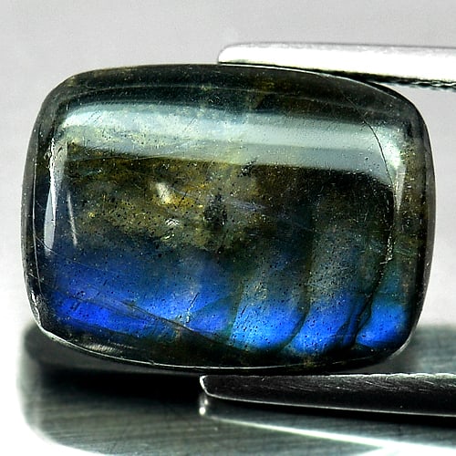 Natural Multi Color Blue Labradorite Doublet 9.16 Ct. Baguette Cabochon Shape 16.2 x 12 Mm. Gemstone: Product ID: 804301169 Product Name: Natural Labradorite Weight: 9.16 CT. Size: 16.2 x 12 x 5 MM. Shape: Baguette Cabochon Color: Multi-Color Clarity:Opaque Luster: Iridescent Gems Origin: Canada Treat