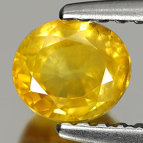 Natural Orangish Yellow Sapphire 0.81 Ct. Oval Shape 5.4 x 4.8 Mm. Gemstone From Thailand: Product ID: 806141176 Product Name: Natural Yellow Sapphire Weight: 0.81 CT. Size: 5.4 x 4.8 x 3.3 MM. Shape: Oval Color: Orangish Yellow Clarity:SI Luster: Good Gems Origin: Thailand Treatment: Heate