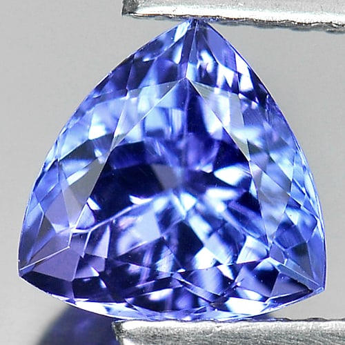 Certified Natural Violetish Blue Tanzanite 1.62 Ct. Clean Trilliant Shape 7.29 x 7.48 Mm. Gemstone: Product ID: 107000226 Product Name: Natural Tanzanite Weight: 1.62 CT. Size: 7.29 X 7.48 X 4.79 MM. Shape: Trillant Color: Blue Clarity:IF Luster: Very Good Gems Origin: Tanzania Treatment: Heated Cry