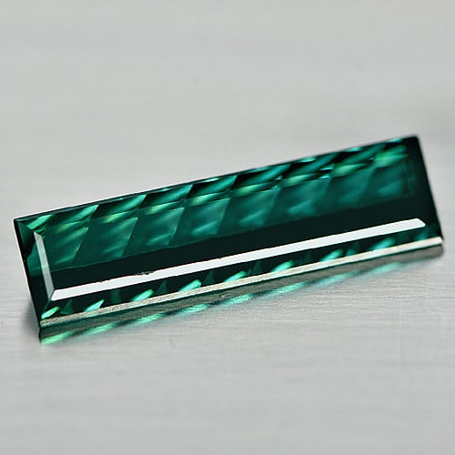 Natural Bluish Green Indicolite Tourmaline 1.78 Ct. VVS Baguette Shape 16.7 x 4.7 Mm. Gemstone: Product ID: 807237392 Product Name: Natural Tourmaline Weight: 1.78 CT. Size: 16.7 x 4.7 x 2.9 MM. Shape: Baguette Color: Bluish Green Clarity:VVS Luster: Good Gems Origin: Nigeria Treatment: Unheated