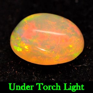 Natural Multi Color Play Of Colour Opal 0.95 Ct. Oval Cabochon Shape 8 x 6.1 Mm. Gemstone From: Product ID: 818721931 Product Name: Natural Opal Weight: 0.95 CT. Size: 8 x 6.1 x 4 MM. Shape: Oval Cabochon Color: Multi Color Clarity:Semi - Transparent Luster: Strong Iridescent Gems Origin: Ethiop