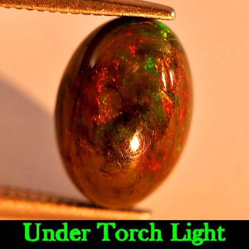 Natural Fire Red Black Opal 1.79 Ct. Oval Cabochon Shape 10.7 x 7.4 Mm. Natural Gemstone From: Product ID: 818725623 Product Name: Natural Opal Weight: 1.79 CT. Size: 10.7 x 7.4 x 5.3 MM. Shape: Oval Cabochon Color: Multi-Color Clarity:Opaque Luster: Iridescent Gems Origin: Ethiopia Treatment: 