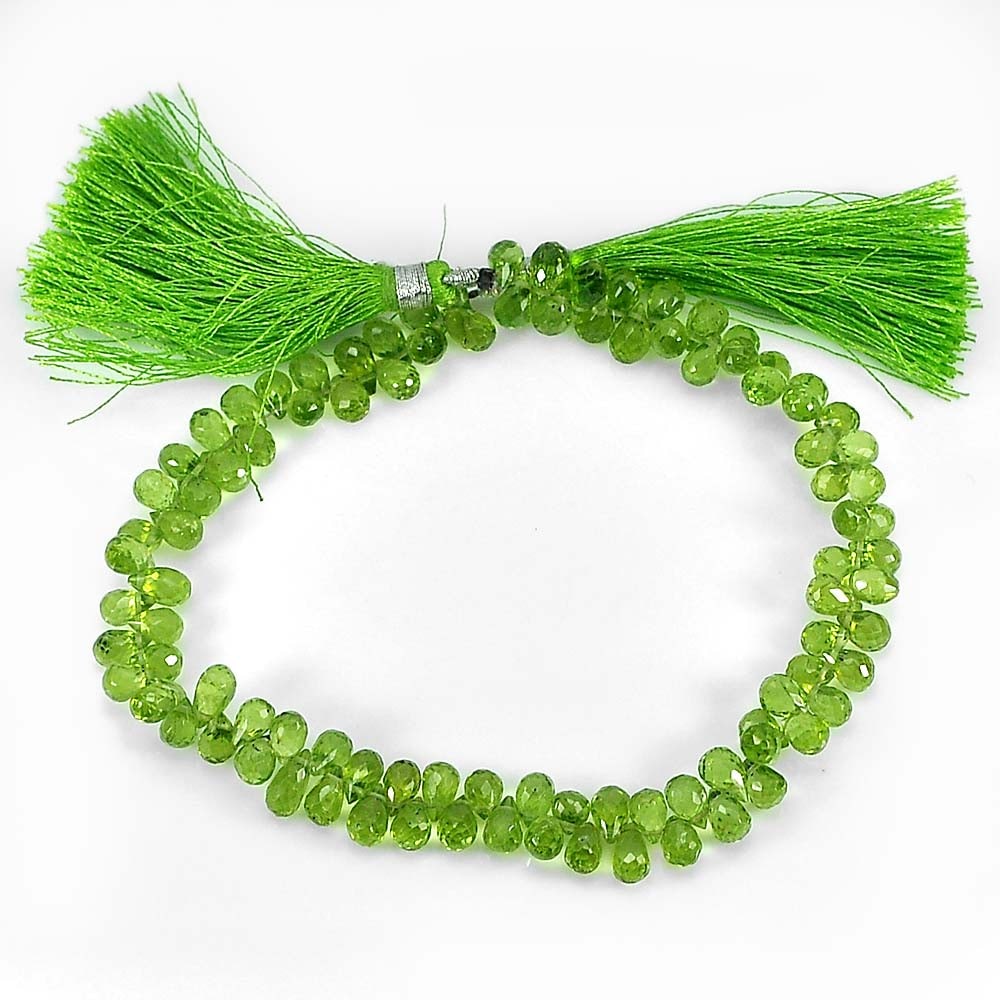 Natural Green Peridot Beads Gemstone Length 9 Inch. Briolette 6 x 4 Mm. 95.40 Ct.: Product ID: 805306812 Product Name: Natural Peridot Weight: 95.40 CT. Size: 9 Inch. / 6 x 4 MM. Shape: Briolette Color: Green Clarity:VVS Luster: Good Gems Origin: Thailand Treatment: Unheated Crystal
