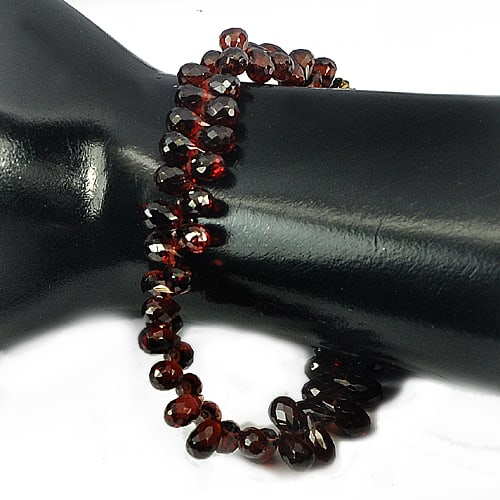 Natural Red Garnet Beads 131.90 Ct. Briolette Shape Unheated Gemstones Length 9 Inch: Product ID: 802918347 Product Name: Natural Garnet Weight: 131.90 CT. Size: 9 Inch / 5.7 x 4.8 x 4.8 MM. Shape: Briolette Color: Red Clarity:VVS Luster: Good Gems Origin: Nigeria Treatment: Unheated C
