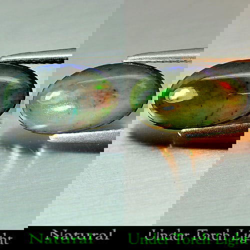 Natural Play Of Color Rainbow Fire Red Black Opal 1.63 Ct. Oval Cabochon Shape 12.7 x 7.6 Mm. (1 of 3)