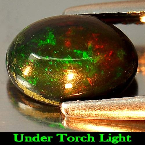 Natural Fire Red Black Opal 1.04 Ct. Oval Cabochon Shape 8.7 x 6 Mm. Gemstone From Ethiopia: Product ID: 818725591 Product Name: Natural Opal Weight: 1.04 CT. Size: 8.7 x 6 x 4 MM. Shape: Oval Cabochon Color: Rainbow Fire Red Black Clarity:Opaque Luster: Iridescent Gems Origin: Ethiopia Treat