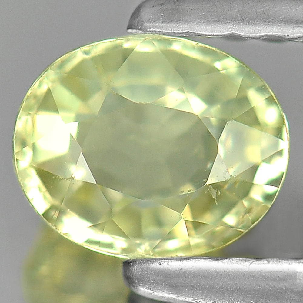 Natural Greenish Yellow Sapphire 0.81 Ct. Oval Shape 5.9 x 4.7 Mm. Gemstone Bangkaja Chanthaburi: Product ID: 806129910 Product Name: Natural Green Sapphire Weight: 0.81 CT. Size: 5.9 x 4.7 x 3 MM. Shape: Oval Color: Yellow Clarity:VSI Luster: Good Gems Origin: Bangkaja ,Thailand Treatment: Heated