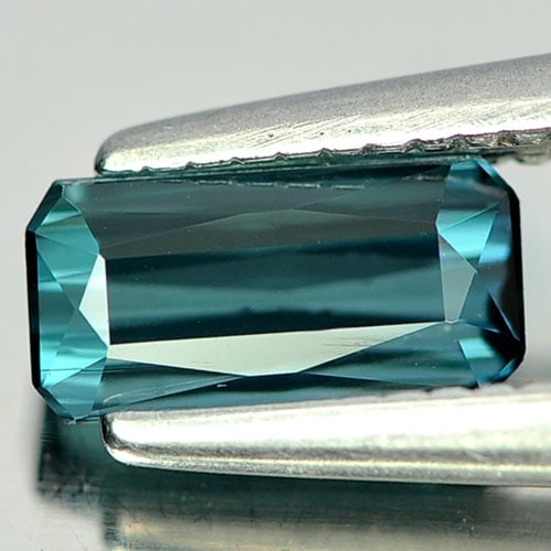 Natural Blue Indicolite Tourmaline 0.59 Ct. Octagon Shape 6.6 x 3.3 Mm. Gemstone From Nigeria: Product ID: 807239802 Product Name: Natural Tourmaline Weight: 0.59 CT. Size: 6.6 x 3.3 x 2.8 MM. Shape: Octagon Color: Blue Indicolite Clarity:VSI Luster: Good Gems Origin: Nigeria Treatment: Unheate