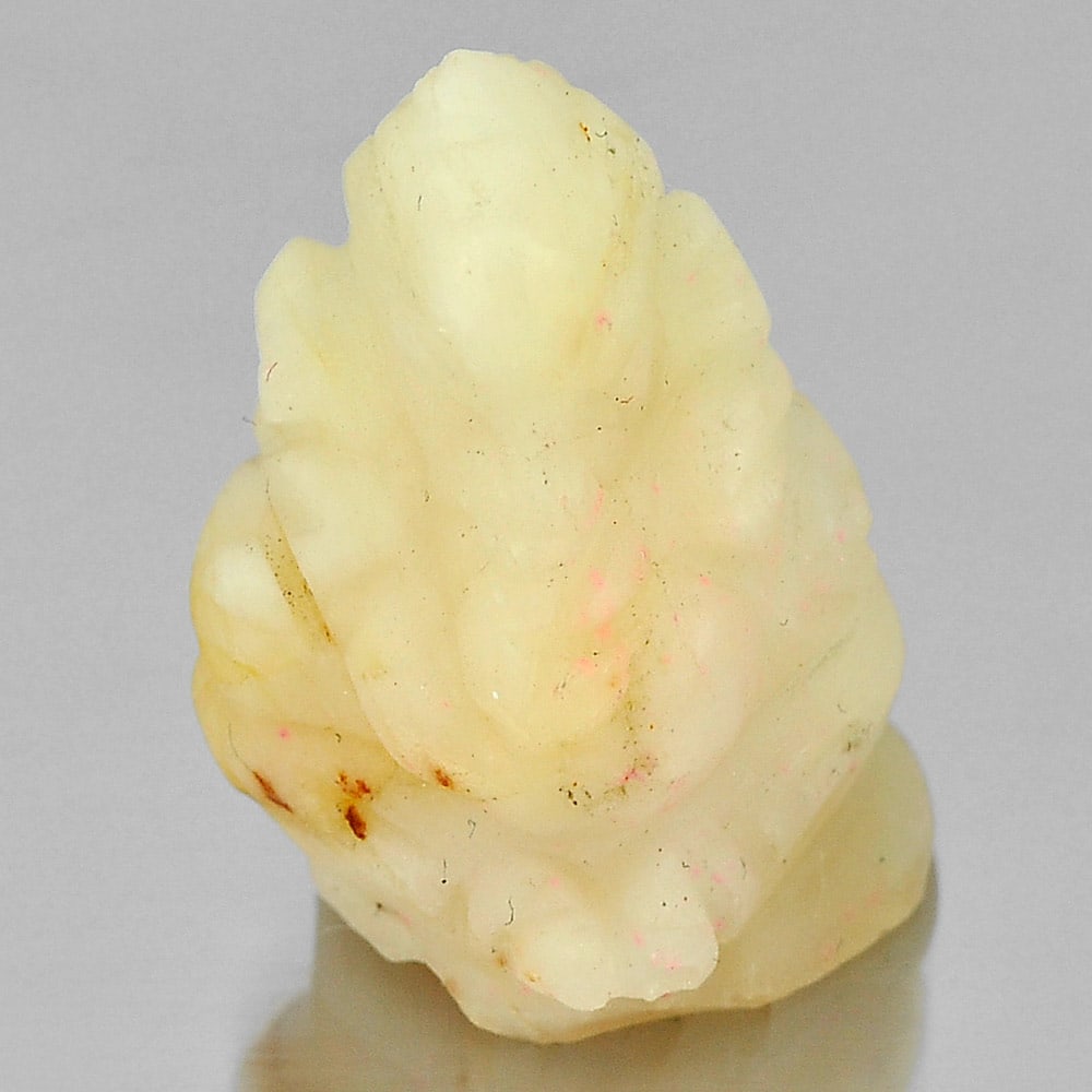 19.09 Ct. Ganesha Carved Natural Petrified Wood From Thailand: Product ID: 819100496 Product Name: Natural Petrified Wood Weight: 19.09 CT. Size: 21 x 16.1 x 12.4 MM. Shape: Ganesha Carved Color: Yellow White Clarity:Opaque Luster: Good Gems Origin: Thailand Trea