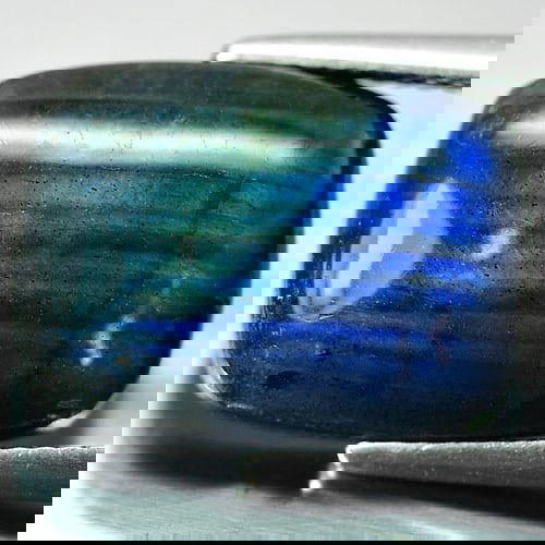 Natural Unheated Multi Color Blue Labradorite Doublet 9.30 Ct. Baguette Cabochon Shape 16.2 x 12 Mm.: Product ID: 804301210 Product Name: Natural Labradorite Weight: 9.30 CT. Size: 16.2 x 12 x 5 MM. Shape: Baguette Cabochon Color: Multi-Color Clarity:Opaque Luster: Iridescent Gems Origin: Canada Treat