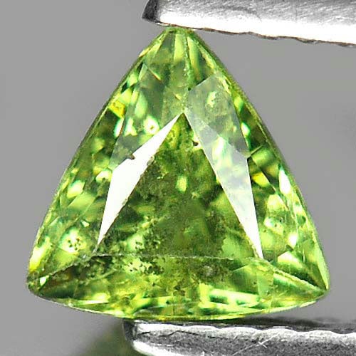 Natural Green Demantoid Garnet 1.03 Ct. Trilliant Shape 6.4 x 6.2 Mm. Unheated Gemstone From: Product ID: 802915846 Product Name: Natural Demantoid Weight: 1.03 CT. Size: 6.4 x 6.2 x 3.8 MM. Shape: Trilliant Color: Green Clarity:SI Luster: Good Gems Origin: Madagascar , Africa Treatment: Unhea