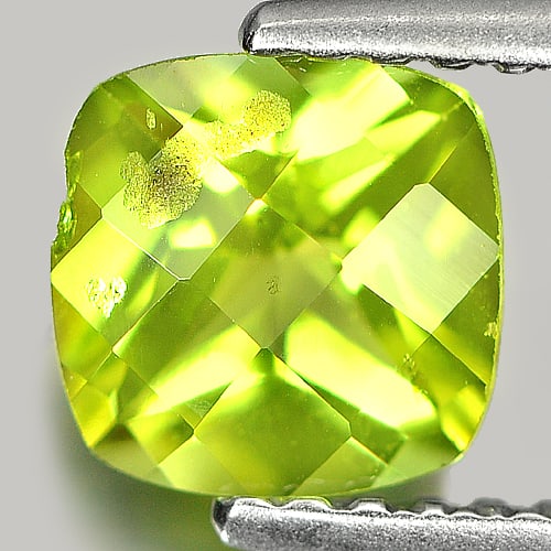 Natural Green Peridot 0.90 Ct. Cushion Checkerboard Cut 6.2 Mm. Gemstone From Thailand: Product ID: 805305198 Product Name: Natural Peridot Weight: 0.90 CT. Size: 6.2 x 6.2 x 3.7 MM. Shape: Cushion Checkerboard Color: Green Clarity:VVS Luster: Good Gems Origin: Thailand Treatment: Unheat