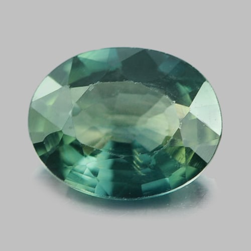 Natural Bluish Green Sapphire 0.69 Ct. Oval Shape 6.5 x 5.2 Mm. Gemstone From Thailand: Product ID: 806154618 Product Name: Natural Green Sapphire Weight: 0.69 CT. Size: 6.5 x 5.2 x 2.5 MM. Shape: Oval Color: Bluish Green Clarity:VSI Luster: Good Gems Origin: Thailand Treatment: Heated C
