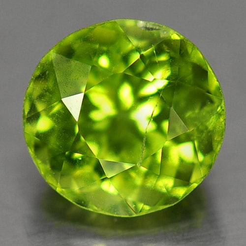 Natural Green Peridot 1.40 Ct. Round Shape 6.7 Mm. Gemstone From Thailand: Product ID: 805303984 Product Name: Natural Peridot Weight: 1.40 CT. Size: 6.7 x 6.7 x 4.8 MM. Shape: Round Color: Green Clarity:SI Luster: Good Gems Origin: Thailand Treatment: Unheated Crystal Struc
