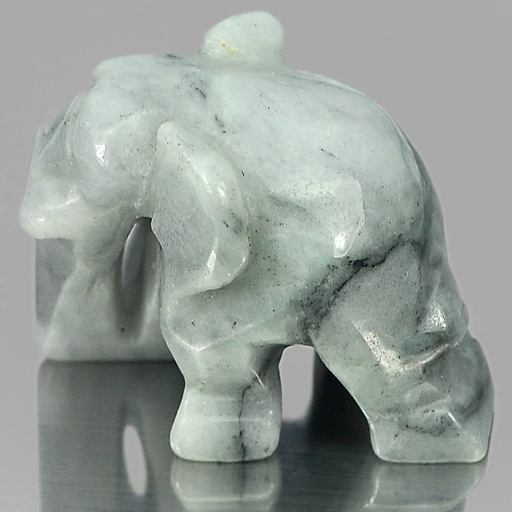 Natural Multi-Color Jade 58.69 Ct. Elephant Carving Size 24 x 19 Mm. Gemstone: Product ID: 819813010 Product Name: Natural Jade Weight: 58.69 CT. Size: 24 x 19 x 17 MM. Shape: Elephant Carving Color: Multi-Color Clarity:Opaque Luster: Good Gems Origin: Thailand Treatment: Unheat