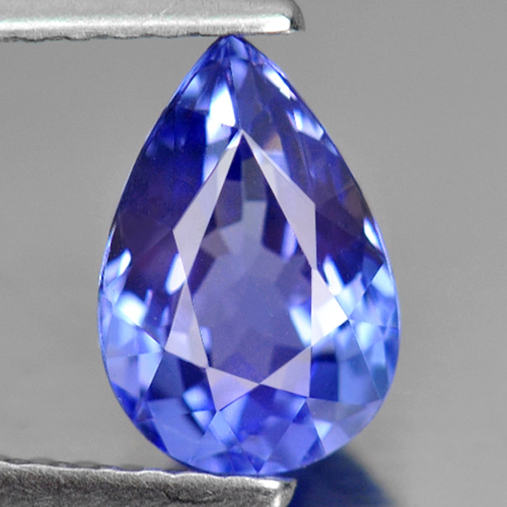 Natural Violetish Blue Tanzanite 1.29 Ct. Clean Pear Shape 8.5 x 5.8 Mm. Gemstone From Tanzania: Product ID: 807005952 Product Name: Natural Tanzanite Weight: 1.29 CT. Size: 8.5 x 5.8 x 4.2 MM. Shape: Pear Color: Violetish Blue Clarity:IF Luster: Very Good Gems Origin: Tanzania Treatment: Heated 