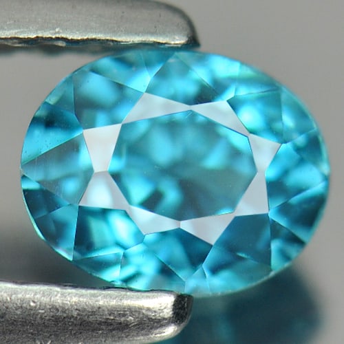 Natural Blue Zircon 0.94 Ct. Clean Oval Shape 5.8 x 4.7 Mm. Gemstone From Cambodia: Product ID: 807713032 Product Name: Natural Zircon Weight: 0.94 CT. Size: 5.8 x 4.7 x 4.2 MM. Shape: Oval Color: Blue Clarity:IF Luster: Good Gems Origin: Cambodia Treatment: Heated Crystal Structure: