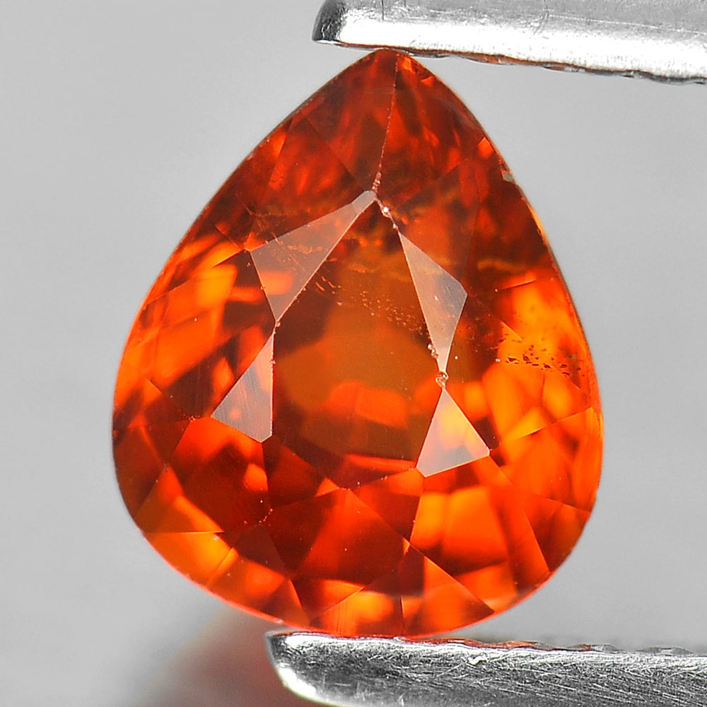Natural Orange Spessartine Garnet 1.38 Ct. Pear Shape 7.2 x 6 Mm. Unheated Gemstone: Product ID: 802926054 Product Name: Natural Spessartine Weight: 1.38 CT. Size: 7.2 x 6 x 4.2 MM. Shape: Pear Color: Orange Clarity:SI Luster: Good Gems Origin: Nigeria Treatment: Unheated Crystal Stru