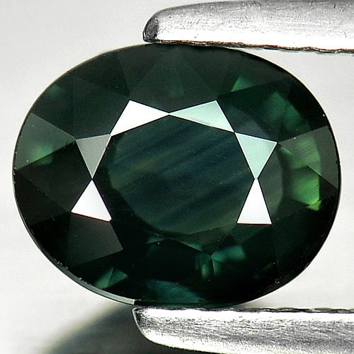 Natural Green Sapphire 1.57 Ct. VVS Oval Shape 7.7 x 6.2 Mm. Gemstone From Thailand: Product ID: 806148457 Product Name: Natural Green Sapphire Weight: 1.57 CT. Size: 7.7 x 6.2 x 3.5 MM. Shape: Oval Color: Bluish Green Clarity:VVS Luster: Good Gems Origin: Thailand Treatment: Heated C